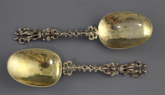 A pair 19th century continental silver gilt spoons with figural terminals, 17.6cm.